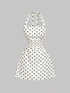 Women's sleeveless polka dot short dress with halter neckline and gathered back