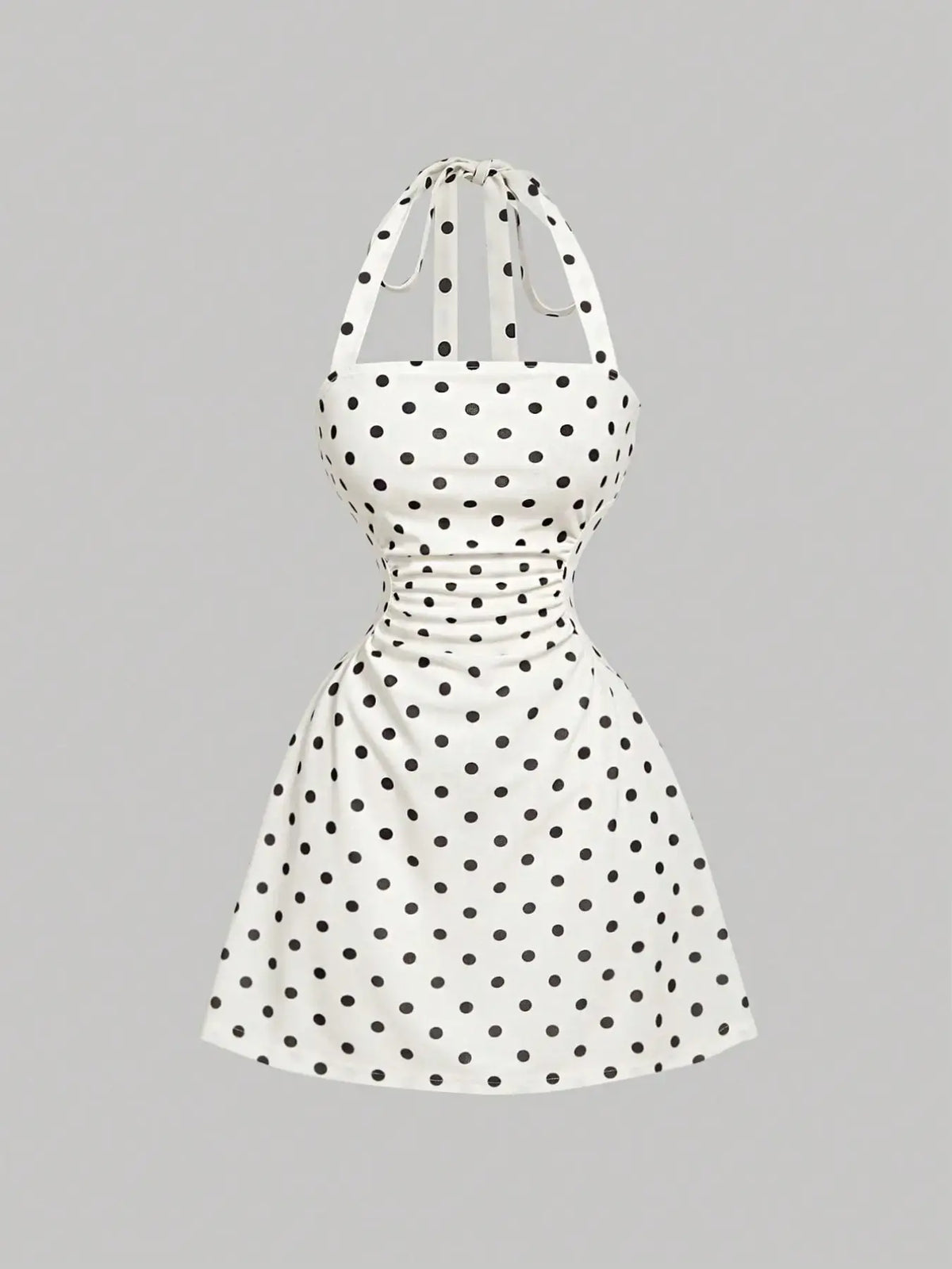 Women's sleeveless polka dot short dress with halter neckline and gathered back