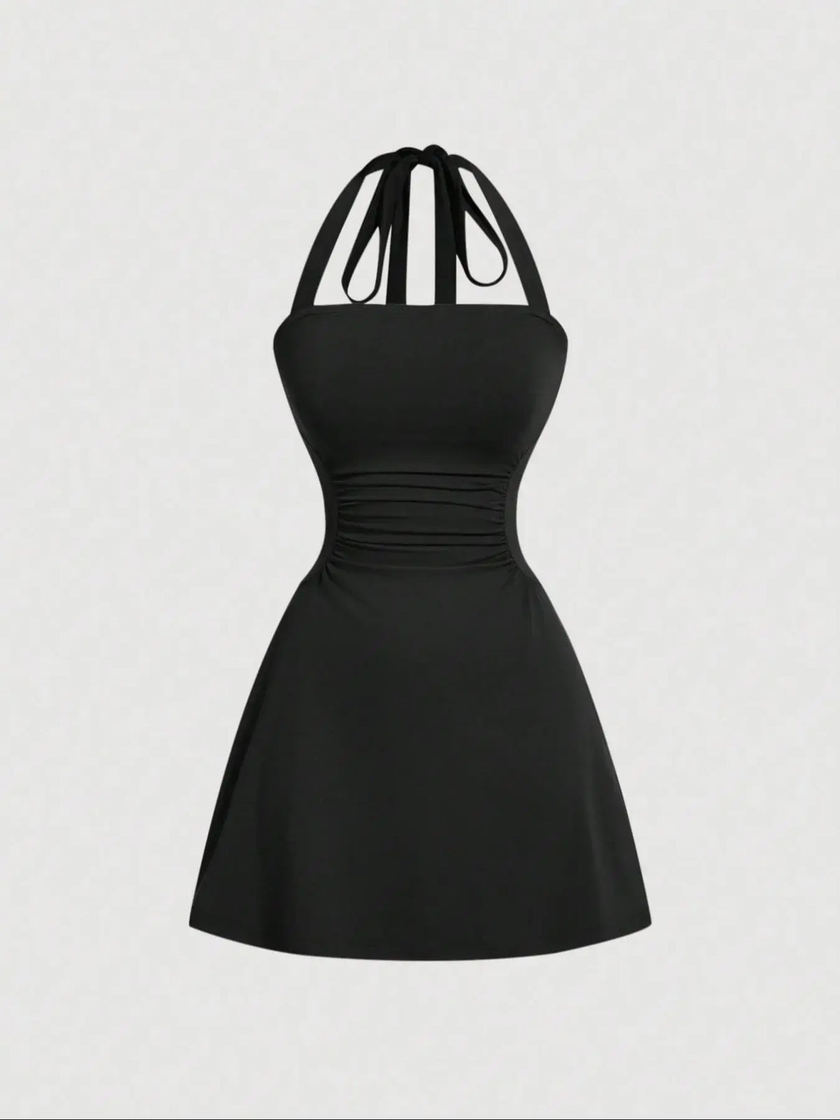 Women's sleeveless polka dot short dress with halter neckline and gathered back