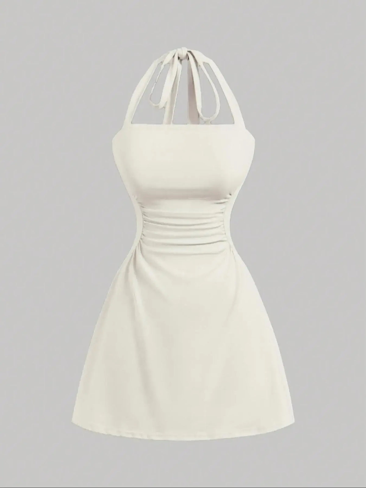 Women's sleeveless polka dot short dress with halter neckline and gathered back